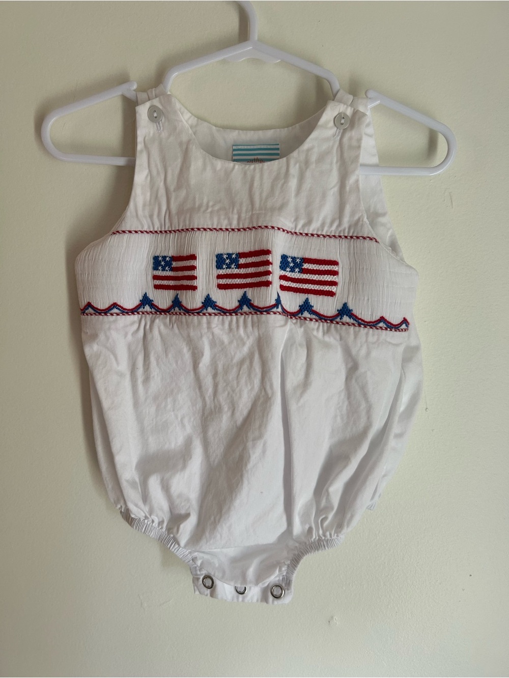 White Smocked Baby One-Piece with American Flag Embroidery